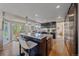 Modern kitchen boasts granite countertops, stainless steel appliances, and a breakfast bar at 10127 W 100Th Ct, Westminster, CO 80021