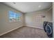 Functional laundry room with a large window and modern appliances at 10127 W 100Th Ct, Westminster, CO 80021