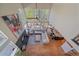 Open-concept living room with fireplace, hardwood floors, and vaulted ceilings at 10127 W 100Th Ct, Westminster, CO 80021