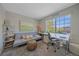 Well-lit office space with a large window and functional furniture at 10127 W 100Th Ct, Westminster, CO 80021