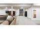 Spacious finished basement with new carpeting, and a stairway to the main floor at 9388 E 59Th Pl, Denver, CO 80238