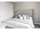 Comfortable bedroom featuring a padded headboard, a closet and soft pillows for a restful night's sleep at 9388 E 59Th Pl, Denver, CO 80238