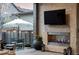Relax and enjoy the outdoors with a cozy fireplace on this beautiful covered patio and outdoor seating at 9388 E 59Th Pl, Denver, CO 80238
