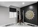 Finished exercise room in basement provides space for fitness activities with window and custom accent wall at 9388 E 59Th Pl, Denver, CO 80238