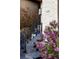 Stylish front entry stairs with decorative tiles and colorful lilac bushes add curb appeal at 9388 E 59Th Pl, Denver, CO 80238