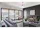 Bright living area with large sliding doors to outdoor space, a comfortable sofa, and modern decor at 9388 E 59Th Pl, Denver, CO 80238