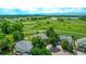 An aerial view showcases the home's location backing to a lush greenbelt with mountain views at 1588 W 111Th Ave, Northglenn, CO 80234