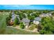 Aerial view of the home displaying its lush backyard with manicured landscaping and water feature at 1588 W 111Th Ave, Northglenn, CO 80234