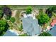 Aerial view of the backyard patio with water feature and well manicured lawn and landscaping at 1588 W 111Th Ave, Northglenn, CO 80234