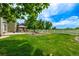 Lush backyard with a gazebo, white fence, well-manicured lawn, perfect for outdoor relaxation and entertainment at 1588 W 111Th Ave, Northglenn, CO 80234