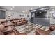 Finished basement with home theater setup, bar area, modern lighting, and comfortable seating at 1588 W 111Th Ave, Northglenn, CO 80234