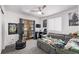 Functional bedroom with a pullout couch, gray walls, hardwood-style flooring, and modern amenities at 1588 W 111Th Ave, Northglenn, CO 80234