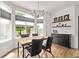 Bright dining room featuring a modern chandelier, large windows, and stylish decor on built-in shelving at 1588 W 111Th Ave, Northglenn, CO 80234