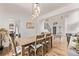 Dining room showcases hardwood floors, modern lighting fixture, and easy access to the living spaces at 1588 W 111Th Ave, Northglenn, CO 80234