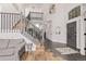Bright open foyer showcases wood and tile flooring, staircase with railing, and soaring ceilings at 1588 W 111Th Ave, Northglenn, CO 80234
