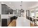 Spacious kitchen with a large island, stainless steel appliances, and an adjacent dining area at 1588 W 111Th Ave, Northglenn, CO 80234