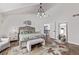 Bright main bedroom featuring hardwood floors, white walls, and decorative touches that create a relaxing atmosphere at 1588 W 111Th Ave, Northglenn, CO 80234