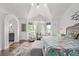 Bright bedroom with a high ceiling, a sitting area, and access to an ensuite bathroom at 1588 W 111Th Ave, Northglenn, CO 80234