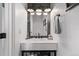 Contemporary powder room featuring stylish fixtures, a vessel sink, and modern lighting at 1588 W 111Th Ave, Northglenn, CO 80234