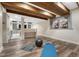 Finished basement area with exposed wood beams and luxury vinyl plank flooring at 2541 Leafdale Cir, Castle Rock, CO 80109