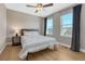 Bedroom with a neutral palette, ceiling fan, and large windows at 2541 Leafdale Cir, Castle Rock, CO 80109