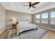 Bedroom with hardwood floors, ceiling fan, and a cozy rug; bright with lots of natural light at 2541 Leafdale Cir, Castle Rock, CO 80109