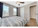 A cozy bedroom featuring two large windows and hardwood floors at 2541 Leafdale Cir, Castle Rock, CO 80109