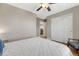 Bedroom featuring a ceiling fan, neutral walls, and a comfortable bed with stylish pillows at 2541 Leafdale Cir, Castle Rock, CO 80109