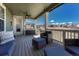 Inviting covered deck with comfortable seating, ceiling fan, and great backyard space at 2541 Leafdale Cir, Castle Rock, CO 80109