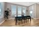 Bright dining room with three large windows and a modern glass table at 2541 Leafdale Cir, Castle Rock, CO 80109