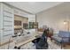 Spacious home office featuring a large desk, stylish decor, and ample workspace at 2541 Leafdale Cir, Castle Rock, CO 80109