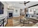 Cozy living room with fireplace, hardwood floors, comfortable sofa, and stylish decor at 2541 Leafdale Cir, Castle Rock, CO 80109