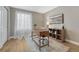 Office area featuring natural light, wooden desk, comfortable chair, and modern decor at 2541 Leafdale Cir, Castle Rock, CO 80109