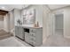 Finished basement wet bar with shaker cabinets, wine fridge and custom millwork at 2541 Leafdale Cir, Castle Rock, CO 80109