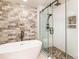 Chic bathroom with a modern tub, glass-enclosed shower, updated fixtures, and neutral-toned decor at 9045 E Floyd Ave, Denver, CO 80231