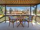 Enjoy outdoor living on this covered deck with seating, perfect for relaxation and entertaining at 9045 E Floyd Ave, Denver, CO 80231