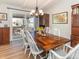 Charming dining room with a wooden table, comfortable seating, and sliding doors to the deck at 9045 E Floyd Ave, Denver, CO 80231