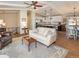 Open-concept living room flowing into a modern kitchen and dining area, perfect for entertaining at 9045 E Floyd Ave, Denver, CO 80231