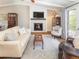 Inviting living room with fireplace, TV, and comfortable seating, creating a relaxing atmosphere at 9045 E Floyd Ave, Denver, CO 80231