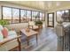 Light-filled sunroom boasts lots of windows and comfortable seating for relaxation at 9045 E Floyd Ave, Denver, CO 80231