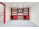 Finished basement with red built-in shelving at 1149 Steele St, Denver, CO 80206