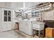 Unfinished basement laundry area with washer, dryer, and utility sink at 1149 Steele St, Denver, CO 80206