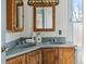 Bathroom with double vanity and wood cabinets at 1149 Steele St, Denver, CO 80206