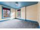 Bedroom with blue ceiling and two windows at 1149 Steele St, Denver, CO 80206