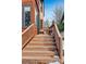 Exterior stairs leading up to a deck with railing at 1149 Steele St, Denver, CO 80206