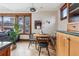 Charming dining area with built-in bench seating and wood-framed windows at 1149 Steele St, Denver, CO 80206