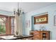 Dining room detail, highlighting the stained glass window and light fixture at 1149 Steele St, Denver, CO 80206