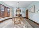 Formal dining room with bay window, chandelier, and built-in cabinetry at 1149 Steele St, Denver, CO 80206