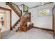 Grand entryway with stained glass windows, built-in bench, and elegant staircase at 1149 Steele St, Denver, CO 80206