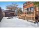 Exterior view of a detached two-car garage in the winter at 1149 Steele St, Denver, CO 80206